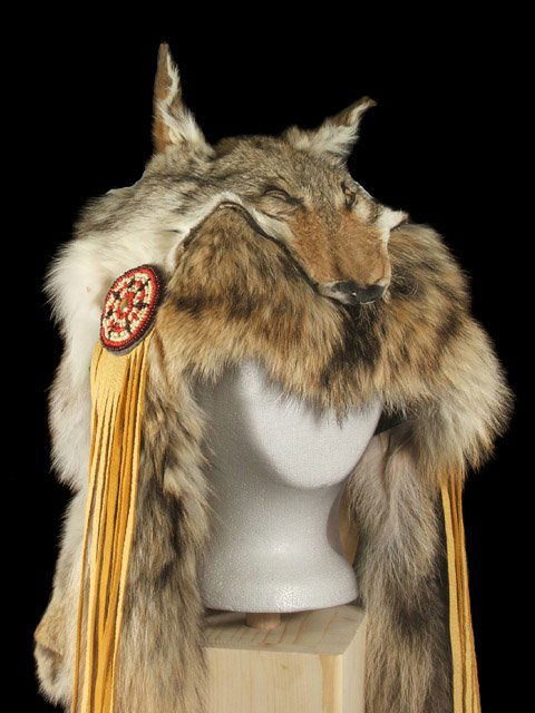 Ceremonial Shaman Coyote Garment: Ceremonial Shaman Coyote Garment, measures approx 50" Long with a 9" Face Width. Completely handmade. Features a full coyote pelt accented by two additional coyote tails, beaded rosettes, leather tass