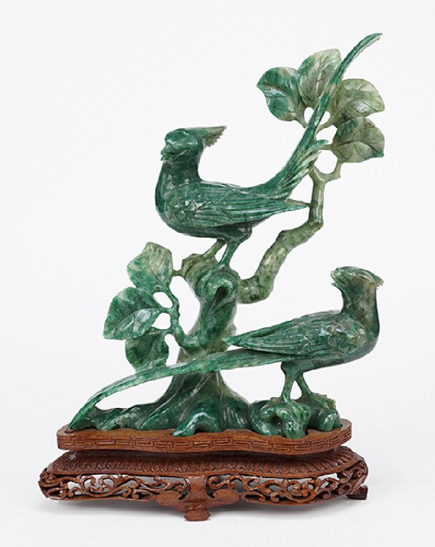 A Carved Spinach Jade Figural Group. (1 of 1)