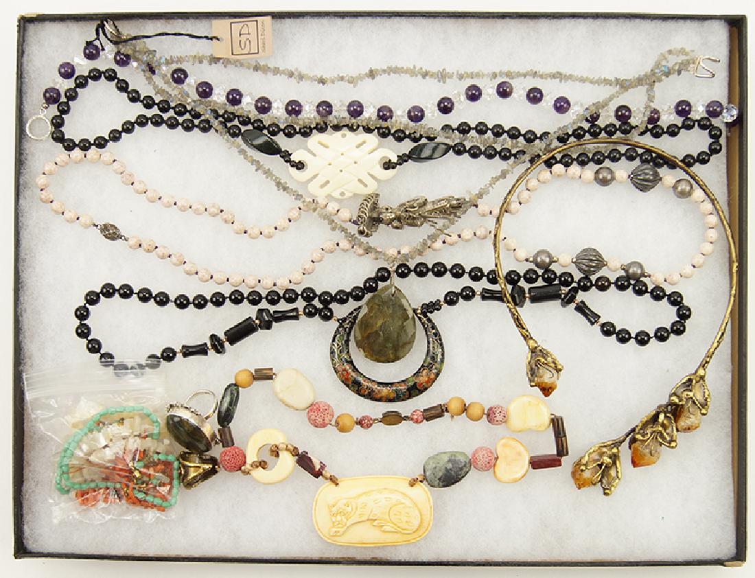 A Collection of Semi-Precious Stone Necklaces.: A Collection of Semi-Precious Stone Necklaces. Comprising an amethyst and clear crystal necklace, an onyx bead necklace, a coral and mother of pearl necklace, a bone and coral necklace, a labradorite