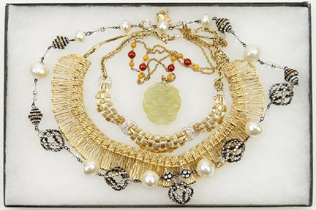 An Alice Caviness Faux Pearl and White Rhinestone: An Alice Caviness Faux Pearl and White Rhinestone Necklace. Together with a Boucher white rhinestone goldtone metal necklace, a Monet goldtone fringe style necklace and a Les Bernard rope necklace