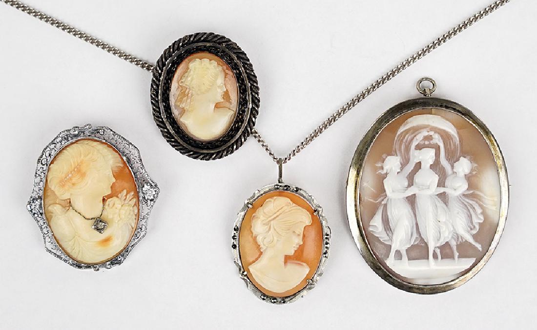 Four Cameo Brooches.: Four Cameo Brooches. Each is a carved shell cameo contains in a sterling silver frame Largest: 2.25" x 1.75"