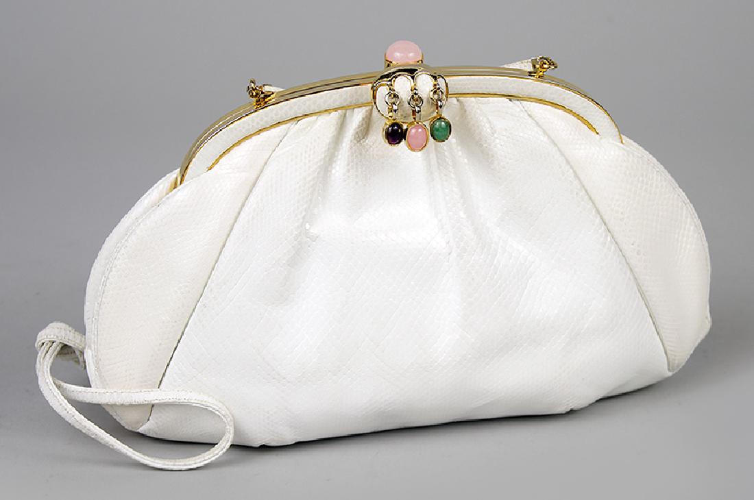 A Judith Leiber White Lizard Skin Clutch.: A Judith Leiber White Lizard Skin Clutch. Bearing goldtone hardware and semiprecious stones adorning the clasp