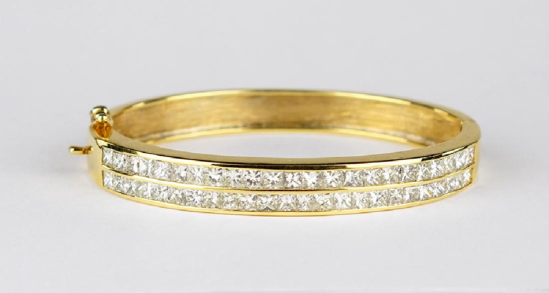 A Diamond and 14 Karat Yellow Gold Bangle Bracelet. (1 of 1)
