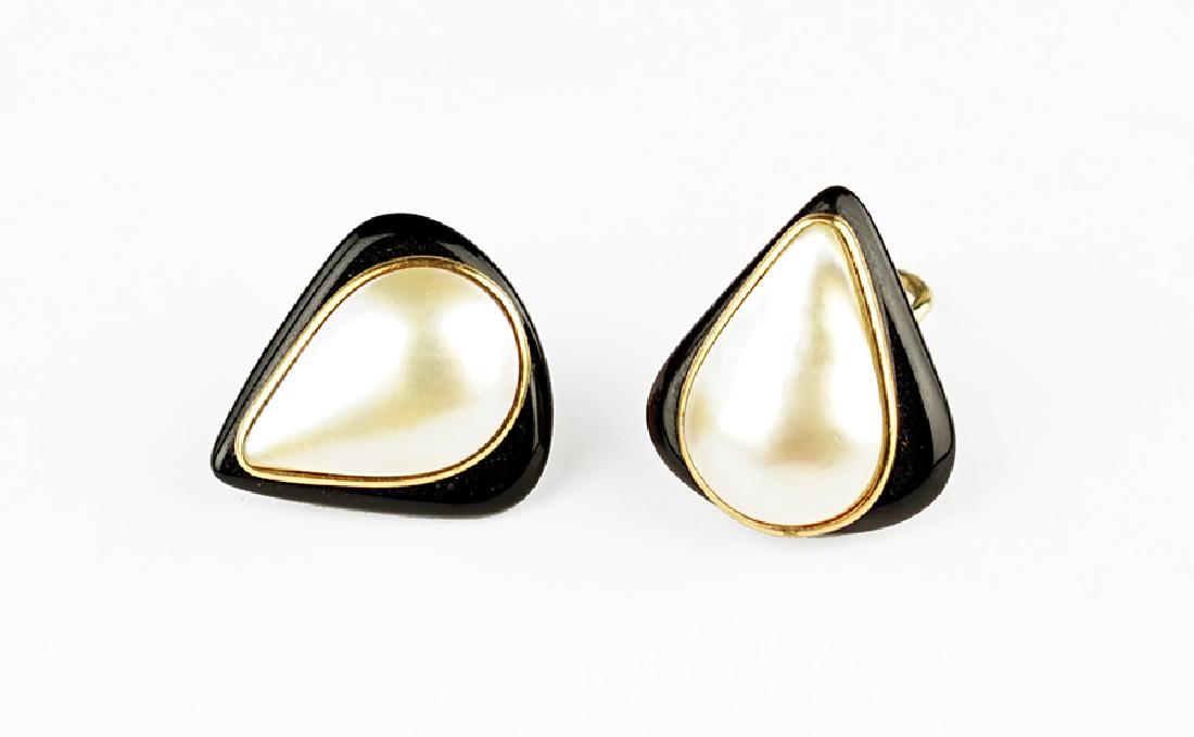 A Pair of Onyx and Pearl Earclips. (1 of 1)