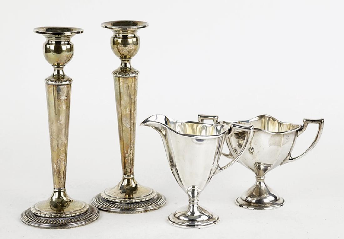 A Pair of Weighted Sterling Silver Candlesticks. (1 of 1)