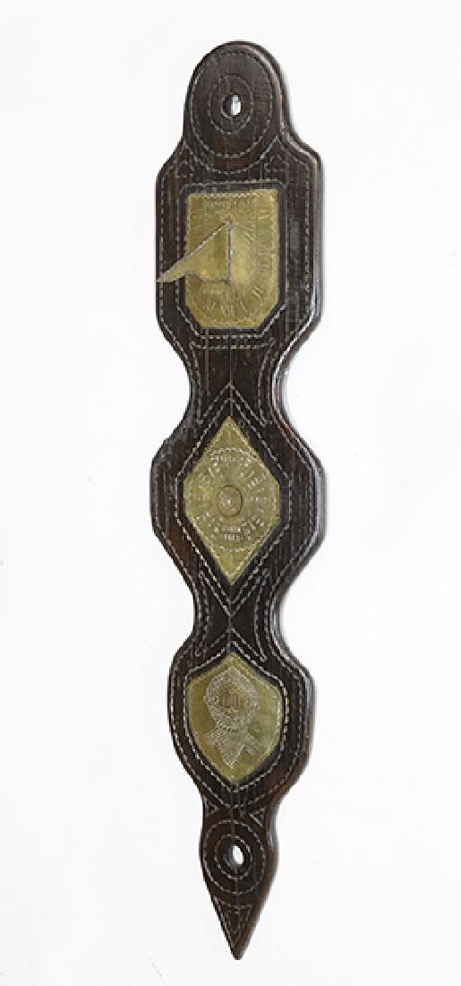 A Scottish Sundial.: A Scottish Sundial. Oak and brass sundial bears a label on the back reading "Sundial from Selkirk Castle Scotland, Late property of Baron Selkirk, Earl of Cassilis" 44" x 19"