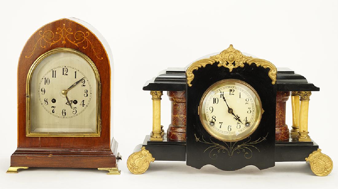 Two Unmarked Mantle Clcoks.: Two Unmarked Mantle Clcoks. Consisting of a black and brass ormolu clock with columns and a wood clock with inlaid scroll work. Susanin's will not comment on the working condition of any watch or cloc