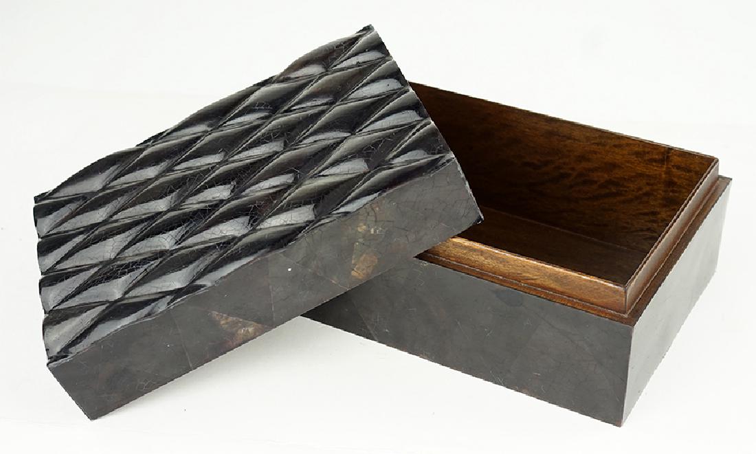 A French R & Y Augousti Box.: A French R & Y Augousti Box. Rectangular horn veneer box with a "quilted" cover. Lined in wood. Underside is signed 4.5" x 9.5" x 7"