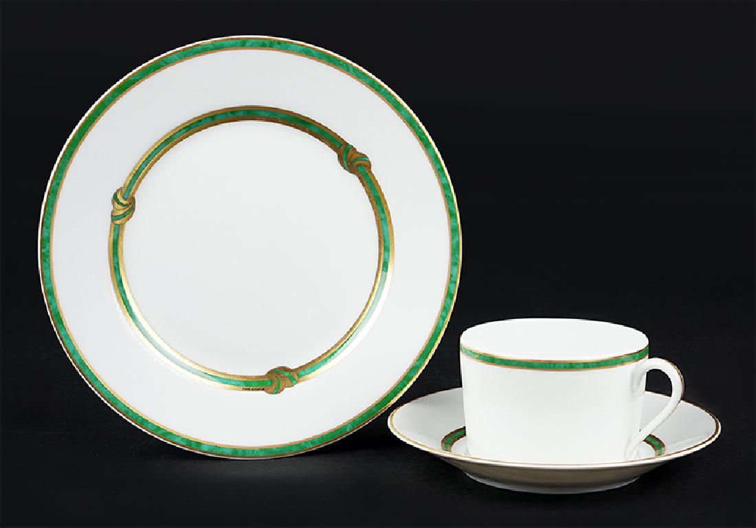 A Christofle Porcelain Dessert Service.: A Christofle Porcelain Dessert Service. Ruban vert pattern. Comprising twelve plates, and eight coffee cups with saucers Plate diameter: 7.5"