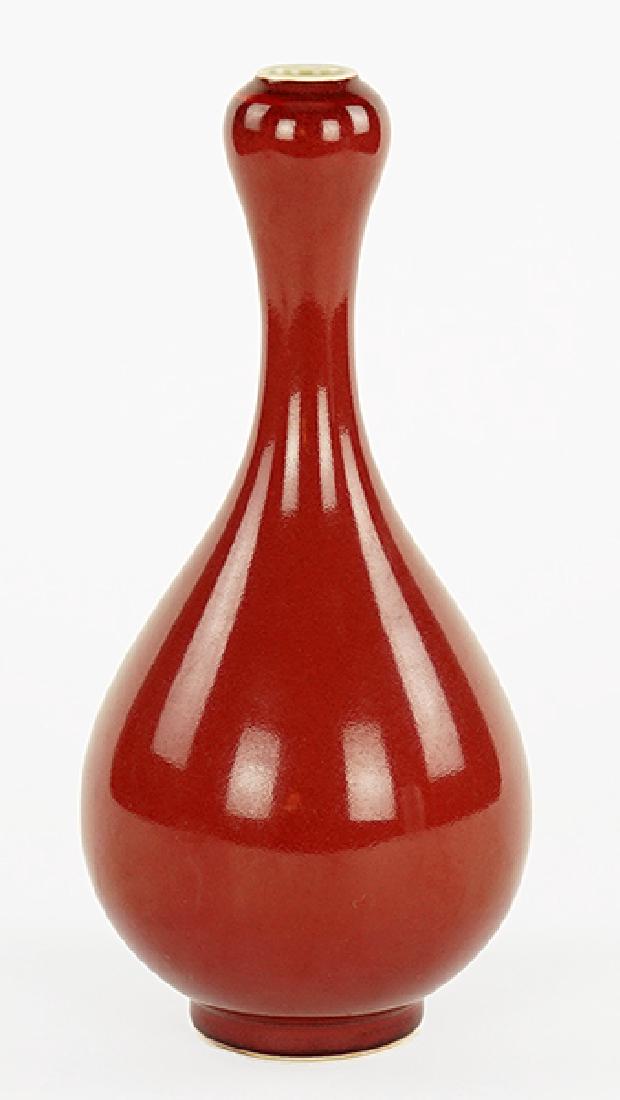 A Chinese Sang de Boeuf Garlic Mouth Vase.: A Chinese Sang de Boeuf Garlic Mouth Vase. Bearing a six-character mark on the underside Height: 11"