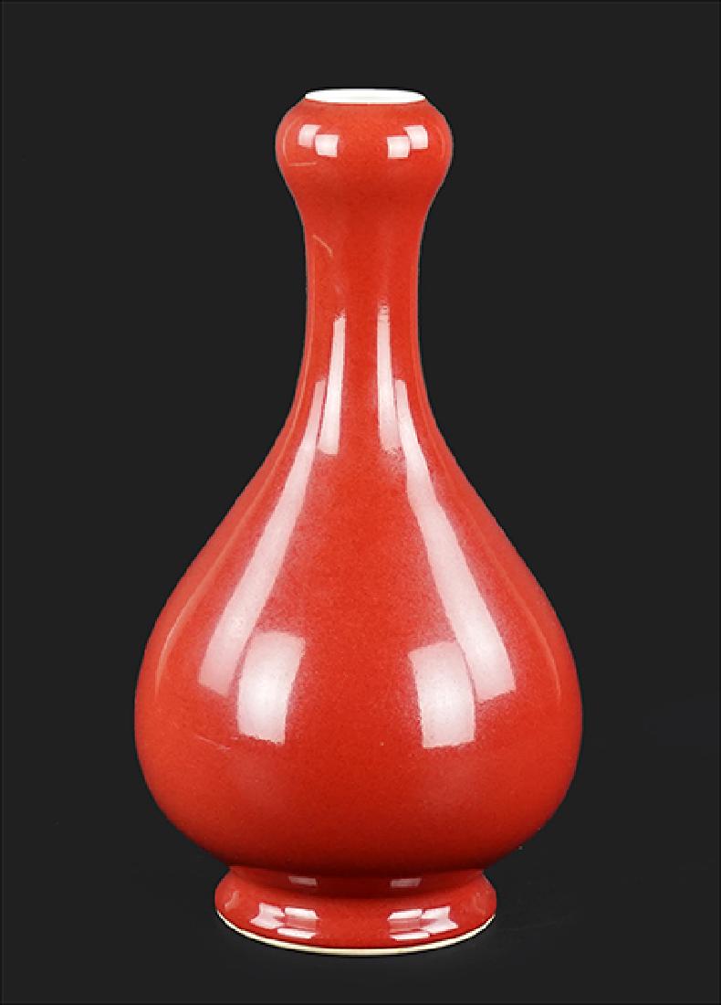 A Chinese Sang de Boeuf Garlic Mouth Vase.: A Chinese Sang de Boeuf Garlic Mouth Vase. Bearing an archaic Qianlong mark on the underside Height: 11.5"