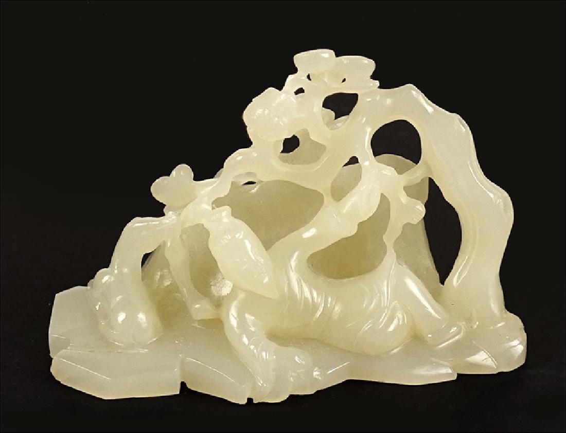 A Chinese Carved White Jadeite Reclining Sage.: A Chinese Carved White Jadeite Reclining Sage. Qing dynasty 2" x 3" x 1 1/4"