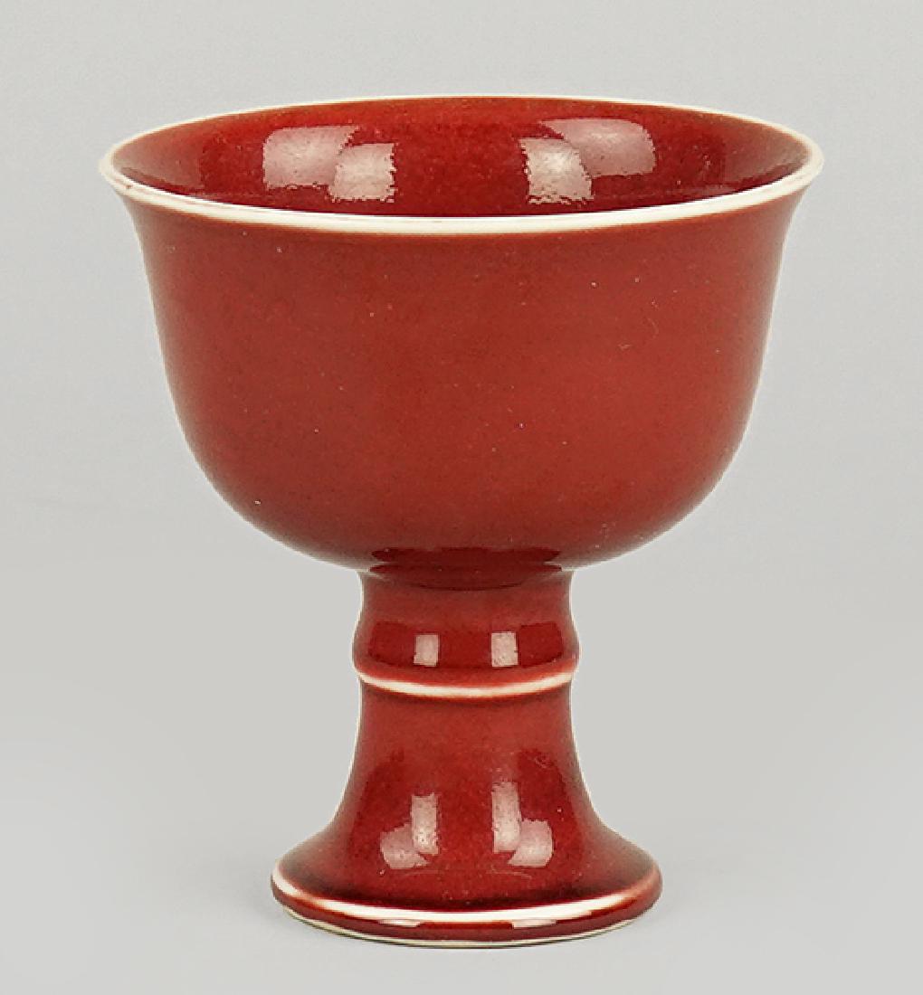 A Chinese Sang De Boeuf Glazed Cup.: A Chinese Sang De Boeuf Glazed Cup. Bearing a six-character mark on the underside 3.5" x 3.25"