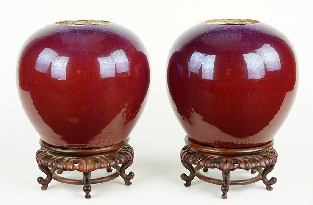A Pair of 19th Century Chinese Sang de Boeuf Globular: A Pair of 19th Century Chinese Sang de Boeuf Globular Form Jars. Height: 7.5"