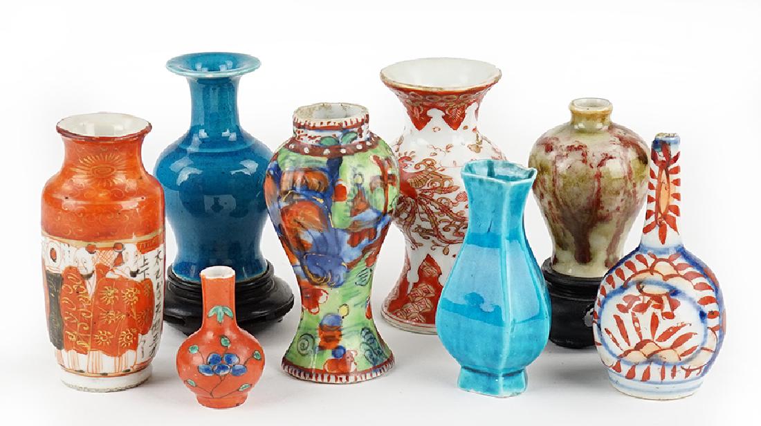 A Collection of Asian Porcelain Cabinet Vases.: A Collection of Asian Porcelain Cabinet Vases. All unmarked. Together with six miniature wood stands Tallest: 3.75"