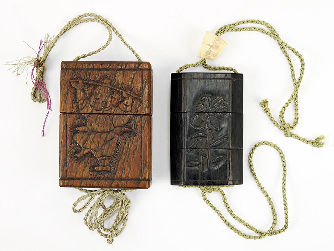 Two Japanese Carved Wood Inro.: Two Japanese Carved Wood Inro. Larger is incised with a fisherman and fish, smaller is ebonized and incised with flowers bearing a carved tooth bead, both signed Larger height: 3"