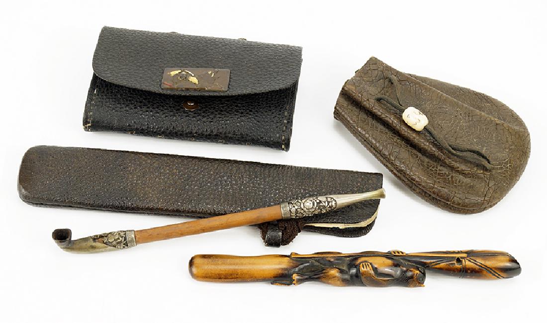 A Group of Japanese Smoking Accessories.: A Group of Japanese Smoking Accessories. Comprising a 19th century silver and bamboo pipe with carrying case, a 19th century kiseru in the form of a badger, a tobacco pouch, and a drawstring pouch Kis