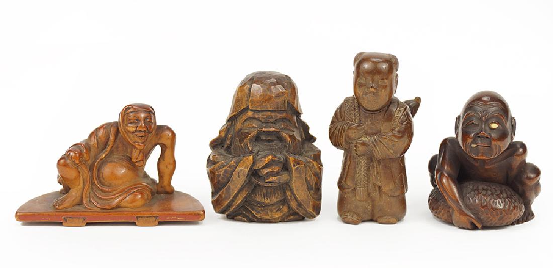 Four Carved Hardwood Figural Netsukes. (1 of 1)