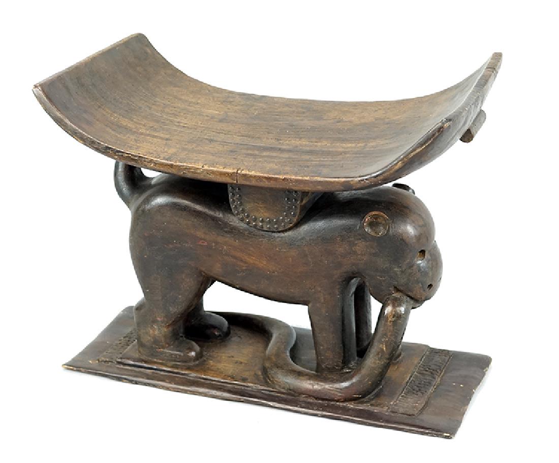 An African Carved Wood Bench.