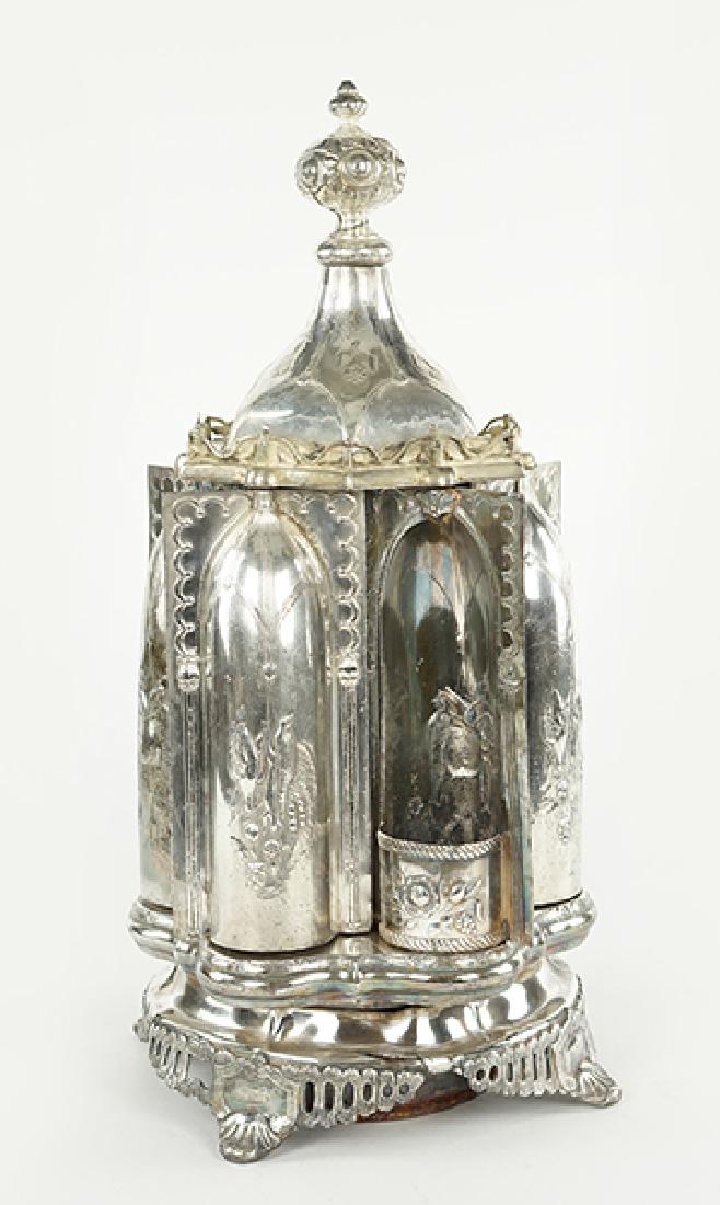 A Roswell Gleason & Sons Gothic Revival Cruet.: A Roswell Gleason & Sons Gothic Revival Cruet. Gothic form silverplate six cavity cruet with an internally revolving mechanism which turns each of the six doors to reveal the bottle compartment. This 
