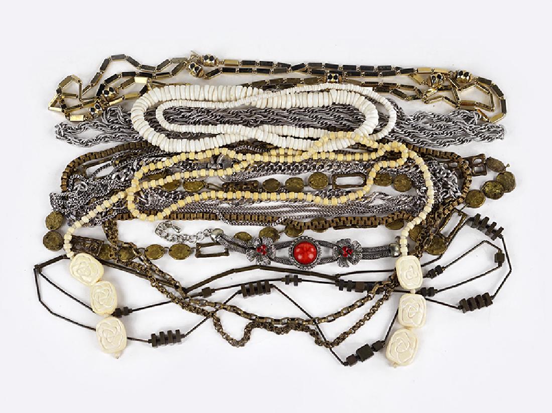 A Miriam Haskell Triple Strand Brass Necklace.: A Miriam Haskell Triple Strand Brass Necklace. Together with three Monet necklaces, a bracelet, a bone lariat, a shell necklace, and two metal link and bead necklaces