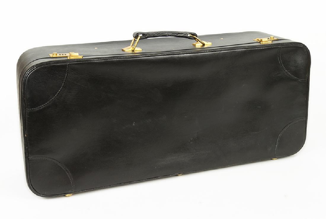 A Tanner & Krolle Black Leather Aston Martin Suitcase.: A Tanner & Krolle Black Leather Aston Martin Suitcase. Lined in red with two pockets 13" x 30" x 8"