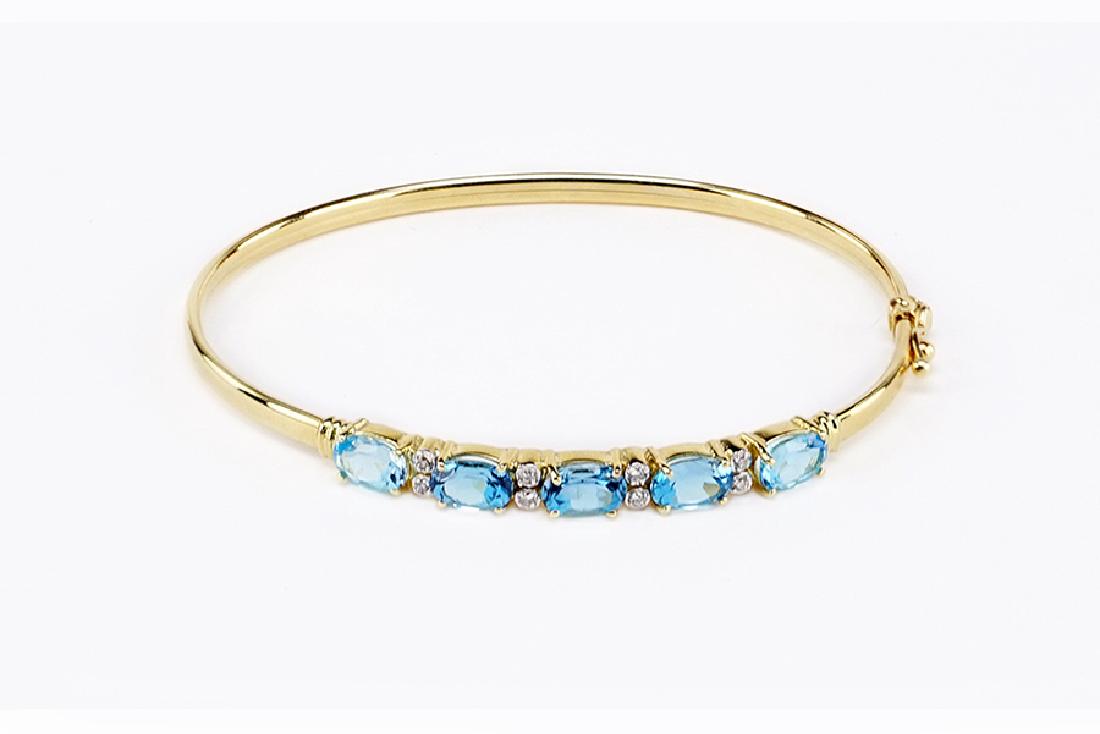 A Blue Topaz and Diamond Bangle Bracelet. (1 of 1)