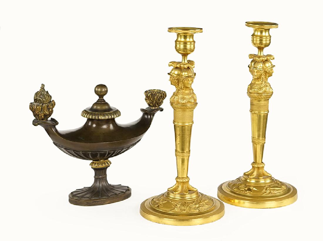 A Pair Of Patinated Bronze Candlesticks. (1 of 1)