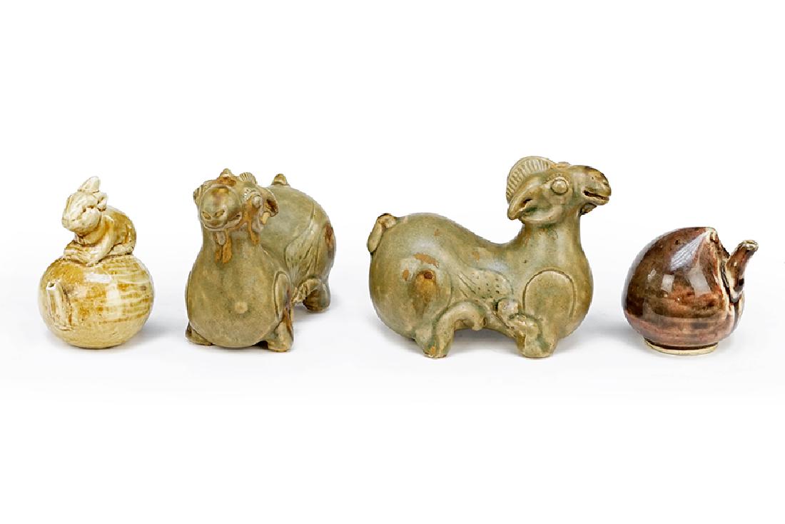 A Pair of Celadon Glazed Ram Form Vessels. (1 of 1)