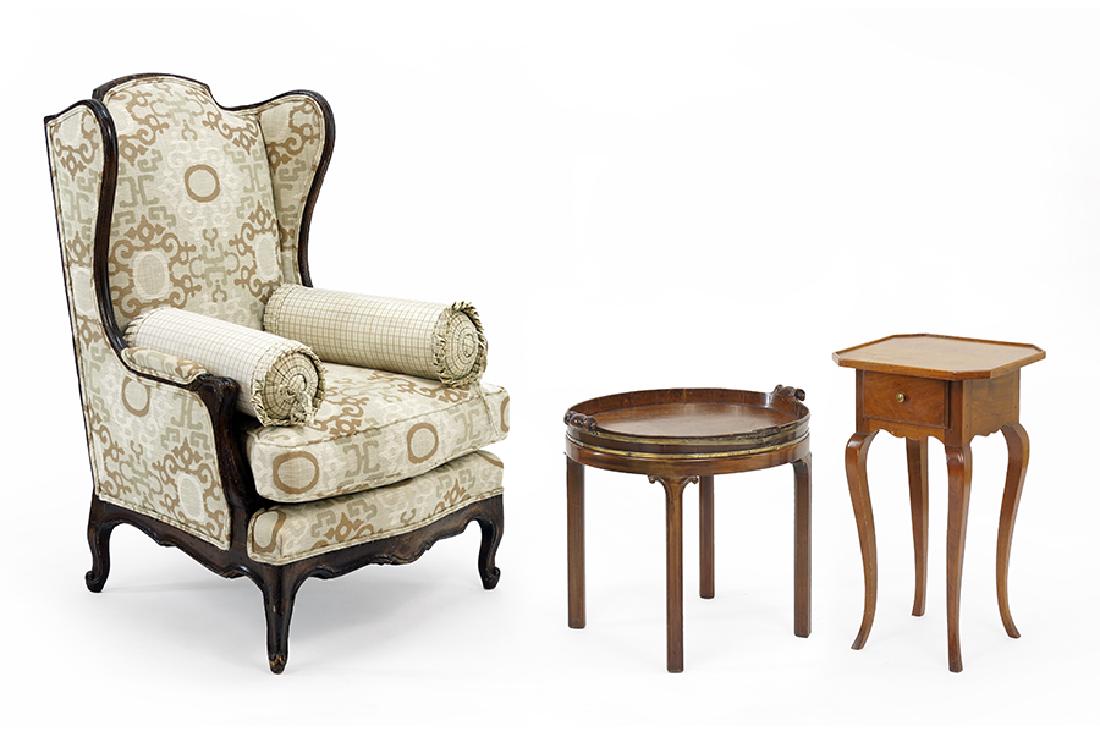 An Upholstered Mahogany Wingback Chair. (1 of 2)