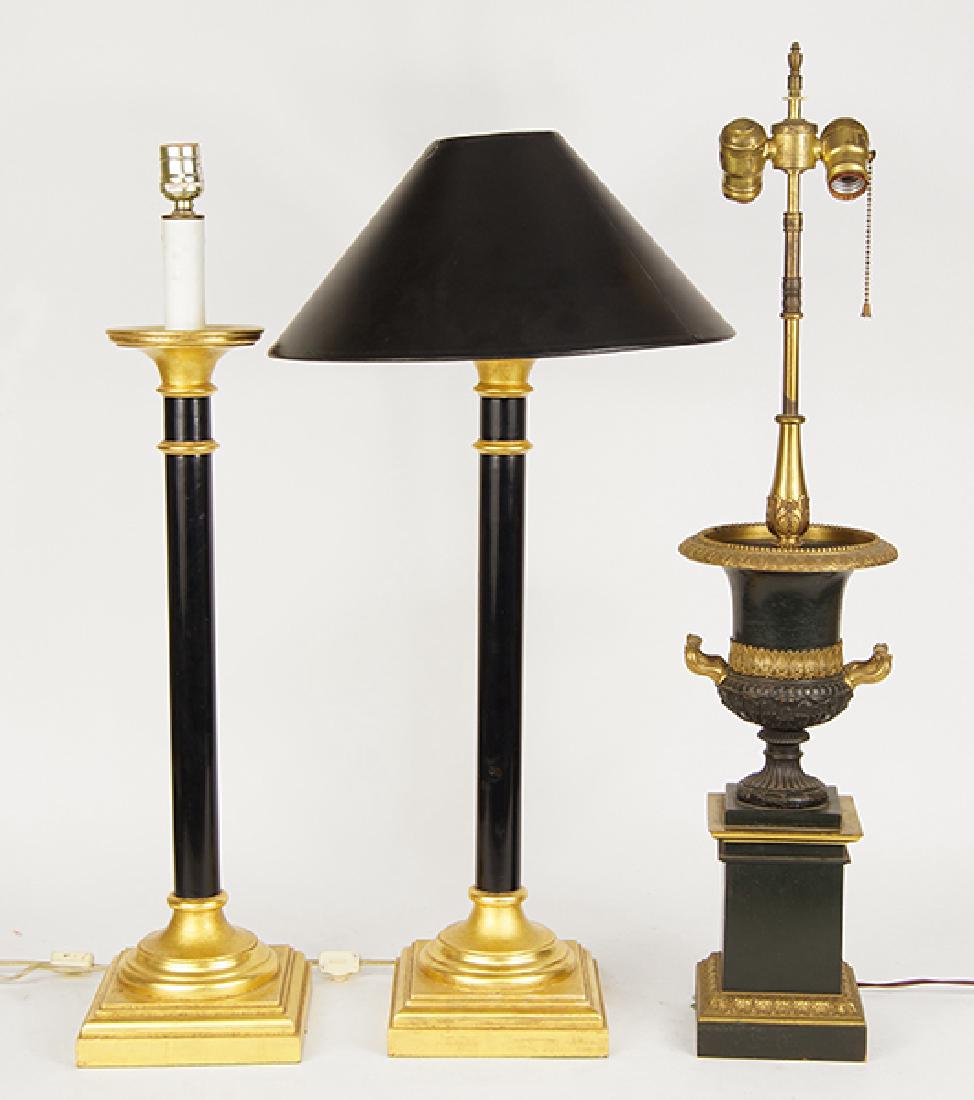 A Pair Of Table Lamps.: A Pair Of Table Lamps. Gilt ebonized wood single light table lamps. Together with a patinated gilt metal table lamp Height: 29", pair height: 28"