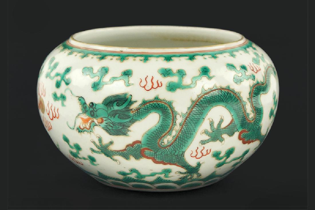 A Chinese Famille Verte Porcelain Brush Washer.: A Chinese Famille Verte Porcelain Brush Washer. Bearing a decoration of five-toed dragons, a flaming pearl, and clouds. With a stamped iron red Daoguang mark on the underside 4" x 6.5"