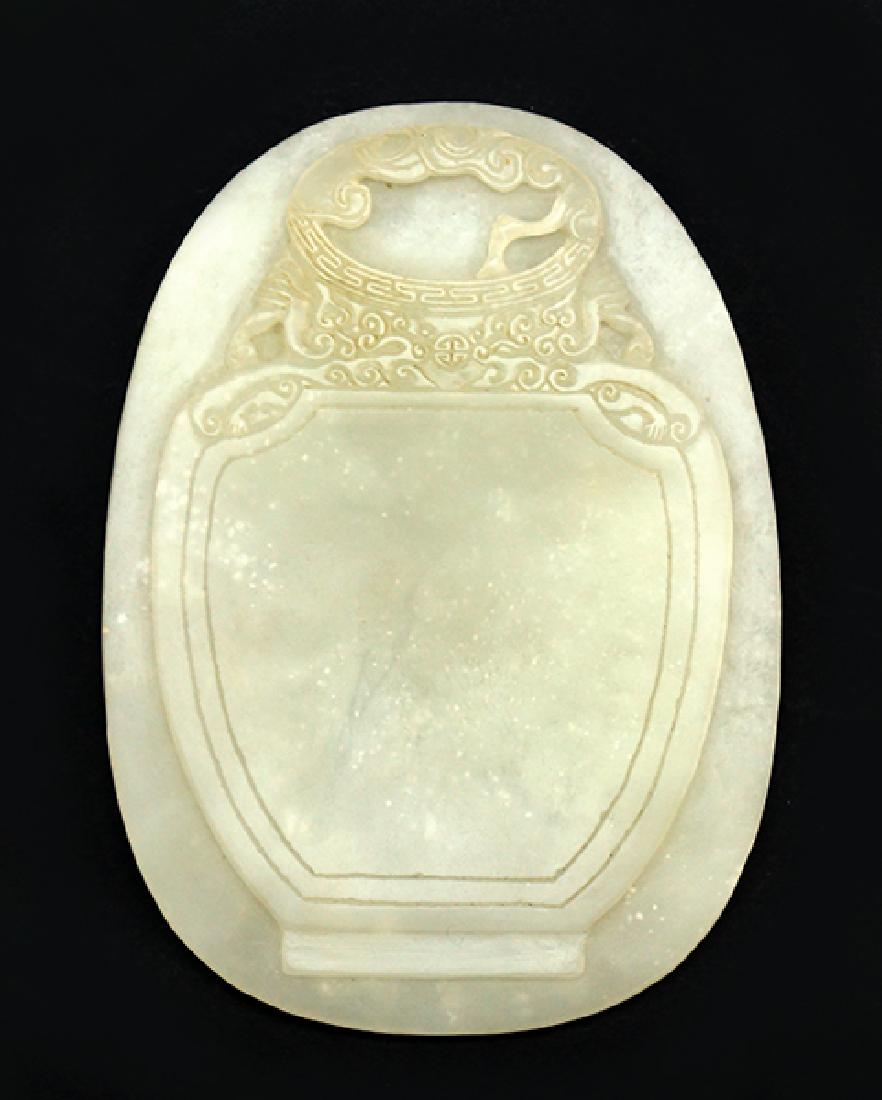 A Chinese Carved Jade Plaque.: A Chinese Carved Jade Plaque. Oval plaque depicting a vase with carved decoration 5.25" x 4"
