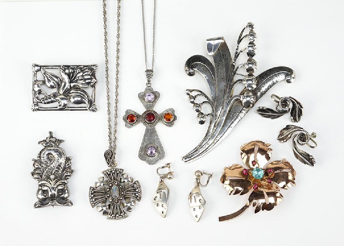 A Collection of Sterling Silver Jewelry.: A Collection of Sterling Silver Jewelry. Comprising a pair of Maricela screwback earrings, a pair of Fridl Blumenthal earrings, a Lily of the Valley brooch, a floral square brooch, a vermeil flower br