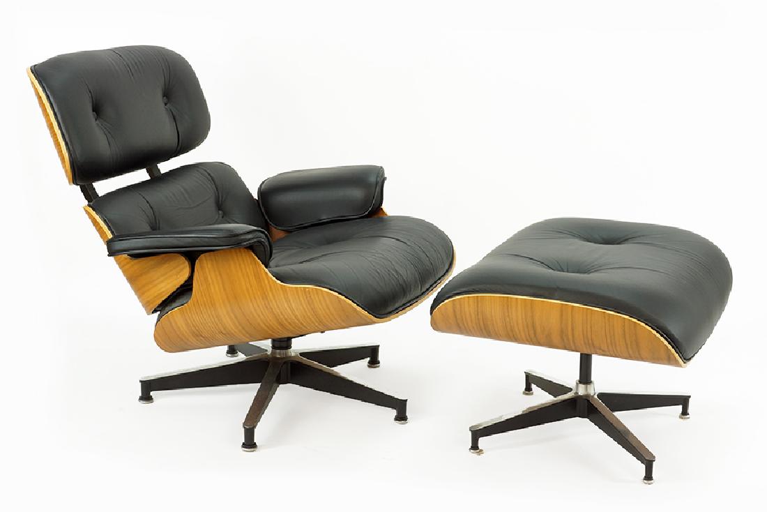 A Charles and Ray Eames for Herman Miller Lounge Chair: A Charles and Ray Eames for Herman Miller Lounge Chair and Ottoman. 670 and 671 chair and ottoman in black leather and molded walnut. Labeled on the underside of both Chair: 31" x 32" x 29" Ottoman: 1