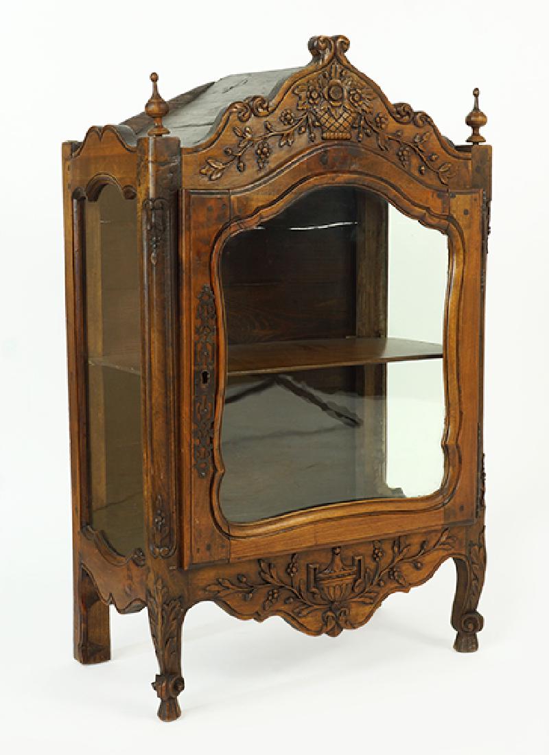 A Continental Carved Walnut Cabinet. (1 of 1)