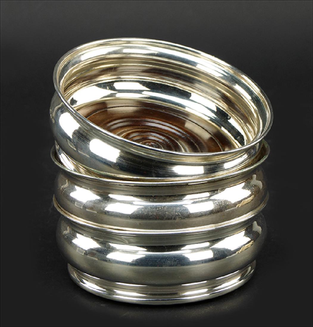 A Set of Three Italian .800 Silver Wine Coasters.: A Set of Three Italian .800 Silver Wine Coasters. Each with a lobed silver round exterior and turned wood interior 2" x 5.75"