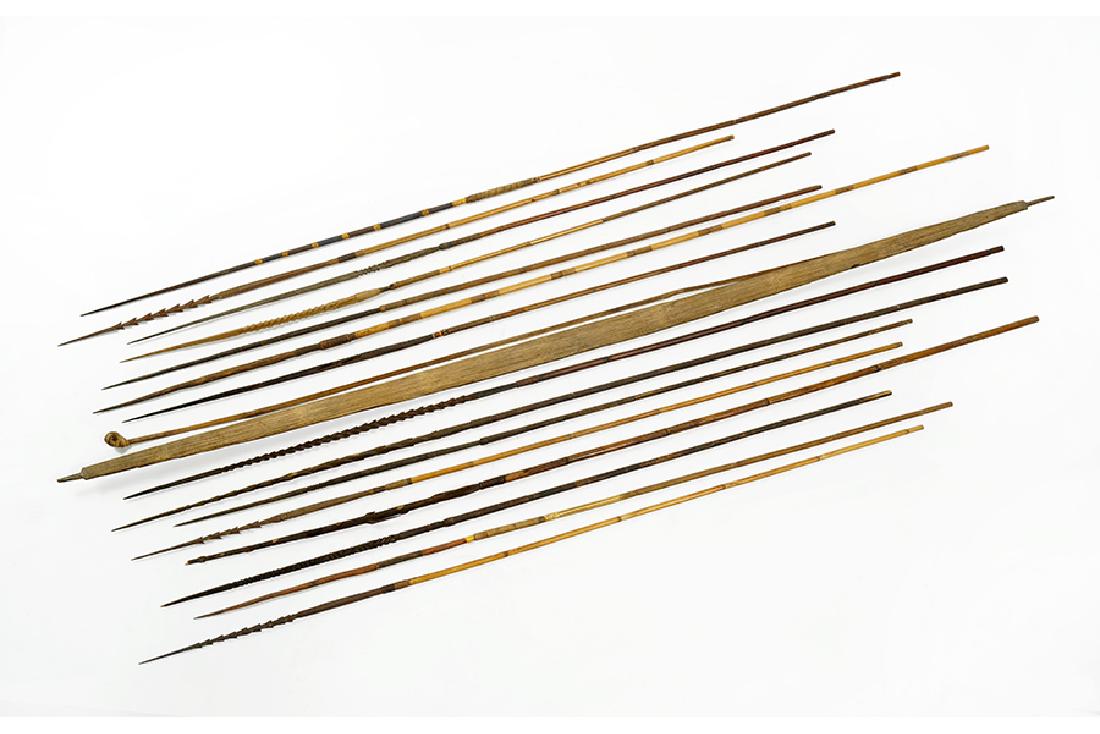 A Papua New Guinea Bow and Arrows.: A Papua New Guinea Bow and Arrows. Comprising a wood bow with fifteen arrows Bow Length: 62"