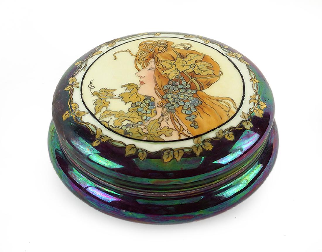 A Tressemann & Vogt Limoges Porcelain Box.: A Tressemann & Vogt Limoges Porcelain Box. T & V Limoges box is decorated with a gilt and painted profile of an Art Nouveau maiden in the style of Mucha 3.5" x 7.25"