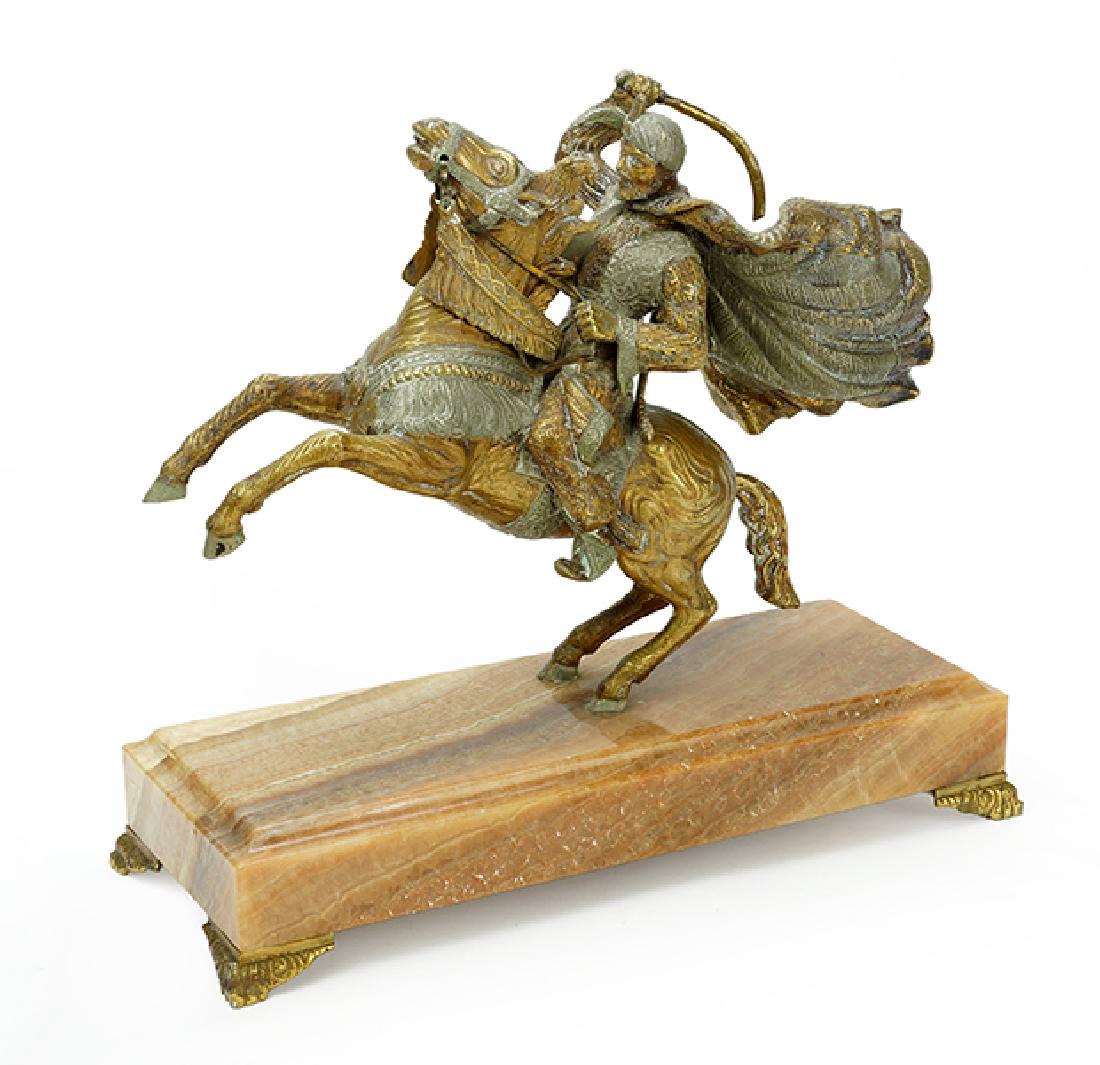 A Two-Tone Metal Sculpture of an Arabian Man on (1 of 1)
