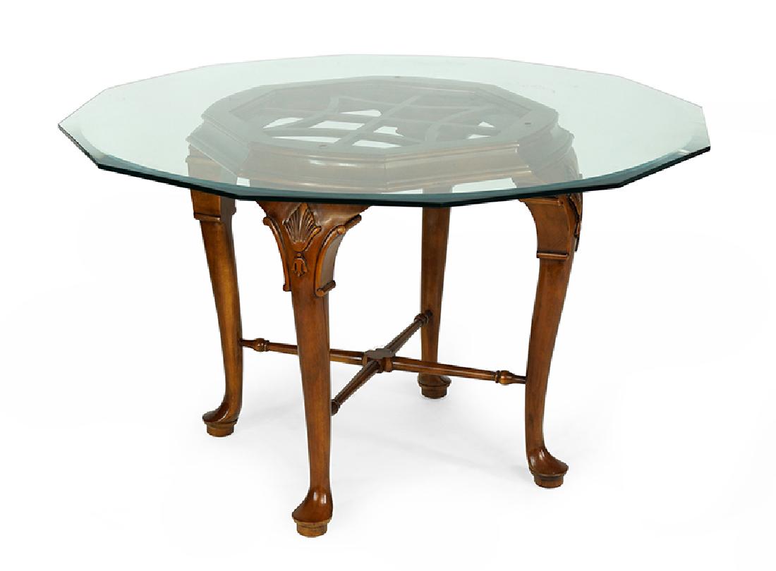A Glass Top Center Table.: A Glass Top Center Table. Twelve sided glass top table on four legged base 29.5" x 48"