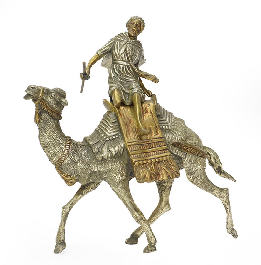 A Patinated Bronze Camel and Rider. (1 of 1)