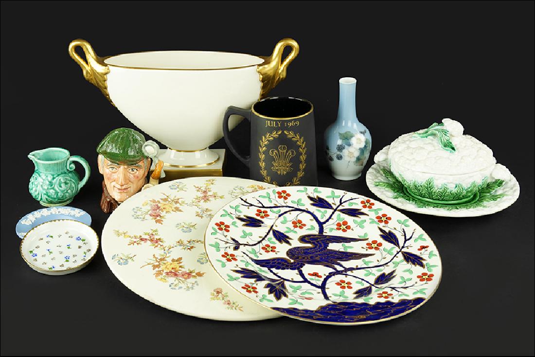 A Collection of Decorative Objects.: A Collection of Decorative Objects. Comprising a Portuguese majolica cauliflower form covered server, two Wedgwood Prince of Wales mugs, A Lenox porcelain vase, a Royal Doulton toby jug of The Sleuth