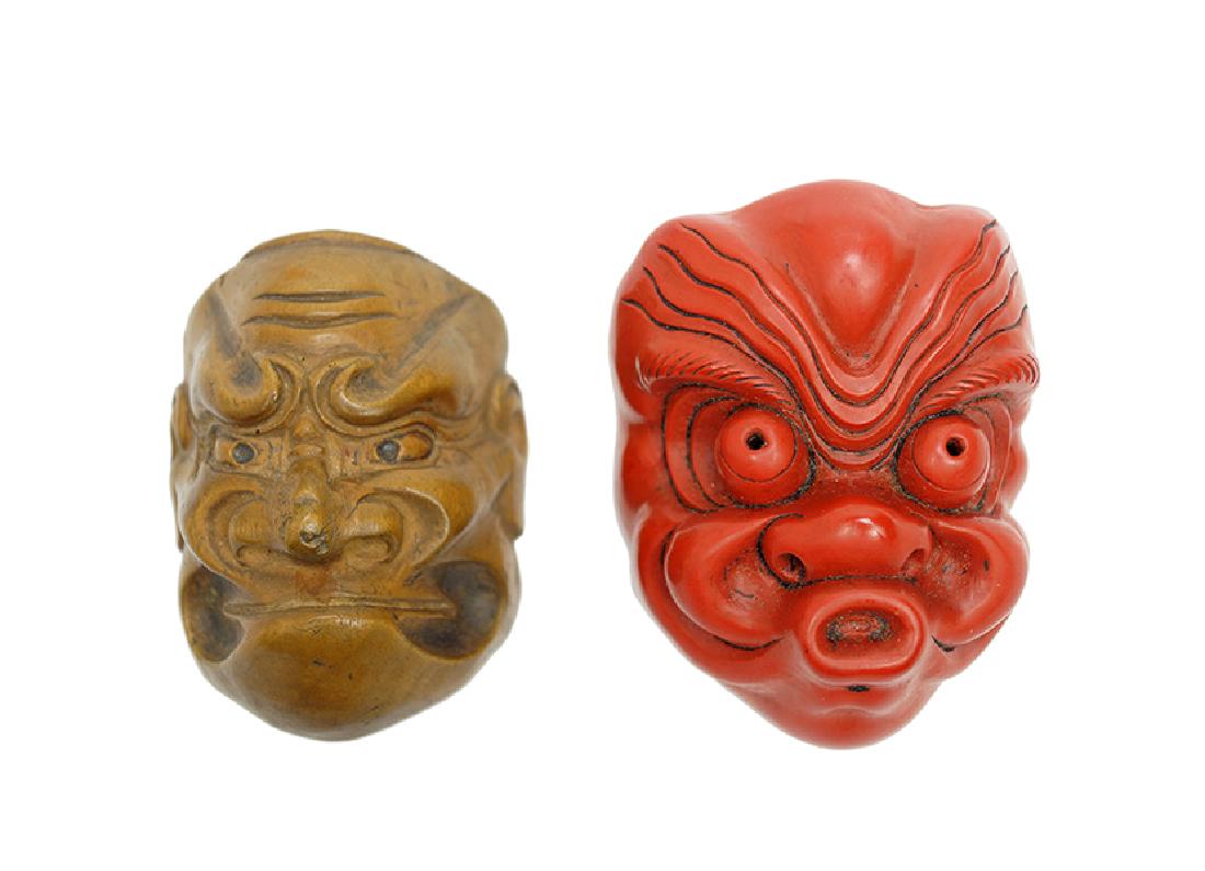 A Red and Black Lacquered Mask Netsuke. (1 of 8)