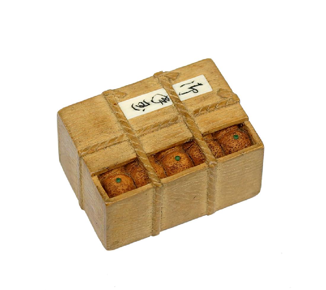 A Carved Wood Netsuke Depicting a Crate of Oranges. (1 of 5)