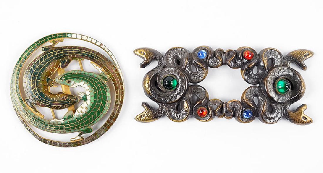 A Guilloche Enamel Lizard Ribbon Buckle.: A Guilloche Enamel Lizard Ribbon Buckle. Lizard forms bear green and brown enamel. Together with a serpent ribbon buckle attributed to Joseff of Hollywood, unmarked Lizard Buckle Diameter: 3.25"