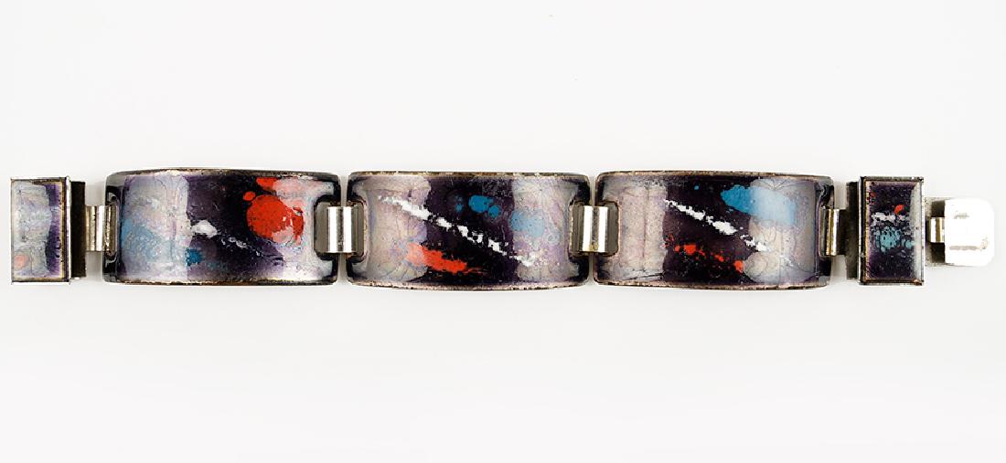 A Modernist Style Scandinavian Enamel Bracelet.: A Modernist Style Scandinavian Enamel Bracelet. Black bracelet of an enamel sheen bearing red, white, and blue abstract forms. Unmarked Length 6.5" Width: .75"