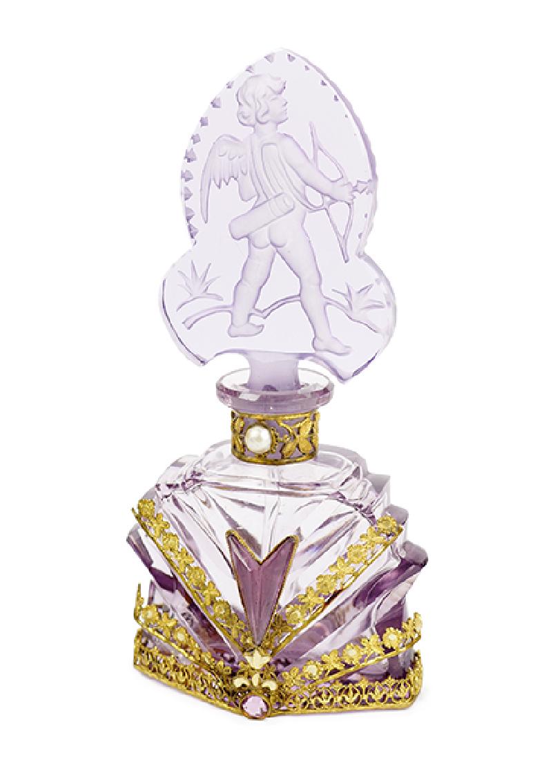 A 1930s Czechoslovakian Amethyst Crystal Perfume: A 1930s Czechoslovakian Amethyst Crystal Perfume Bottle. Jeweled filigree metalwork with clear intaglio stopper, dauber, marked Czechoslovakia. Morlee label on base Height: 5.5"