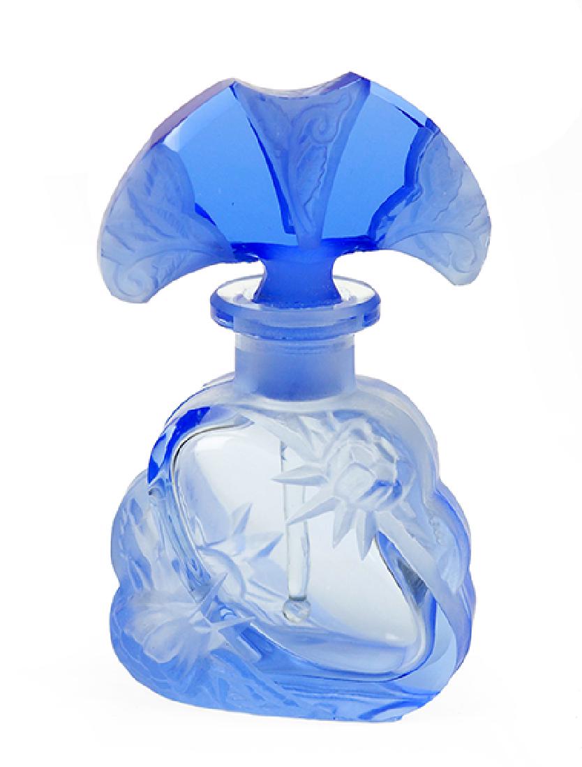 A Czechoslovakian Blue Crystal Perfume Bottle.: A Czechoslovakian Blue Crystal Perfume Bottle. Frosted blue crystal with clear oval on each side and fan shaped stopper with floral sides. Marked Czechoslovakia Height: 4"