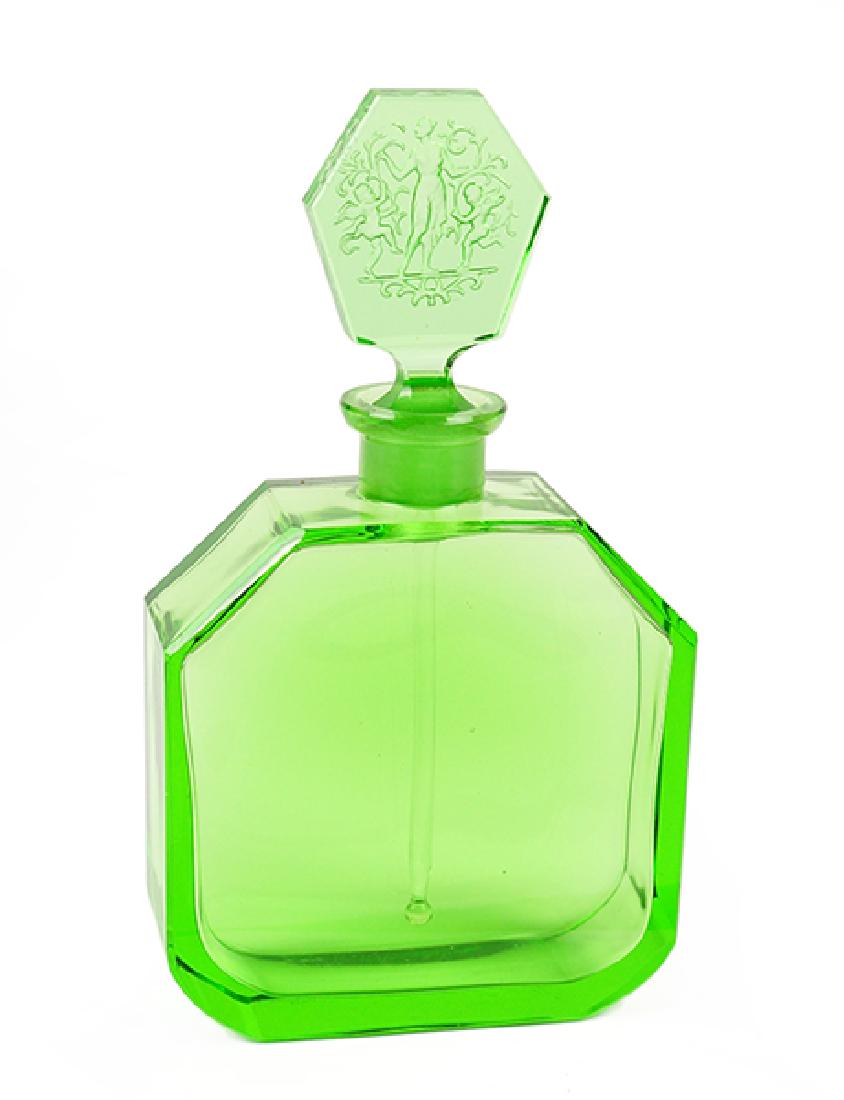 A 1920s Czechoslovakian Green Crystal Perfume Bottle.: A 1920s Czechoslovakian Green Crystal Perfume Bottle. Crystal perfume bottle with intaglio stopper depicting cherubs and a maiden. Marked Czechoslovakia Height: 7.5"